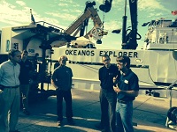 BOEM Environmental Studies Chief Rodney Cluck (r) describes some of the collaborative science that has taken place aboard the Okeanos Explorer with NOAA and other partners.BOEM ActingDirector Walter Cruickshank (l) and Chief Environmental Officer Bill Brown (c) joined the tour.