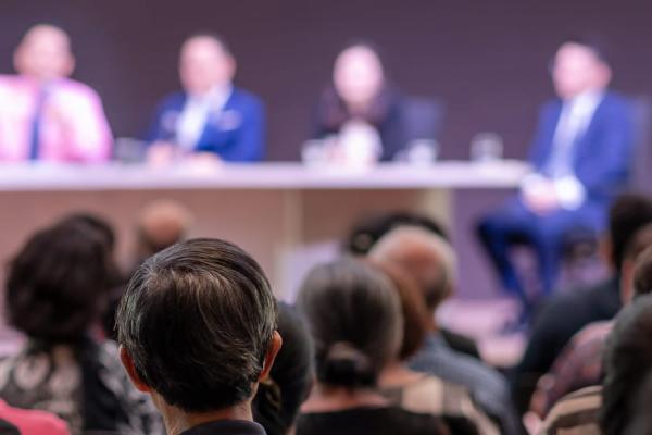 Rear view of Audience in the conference hall or seminar meeting