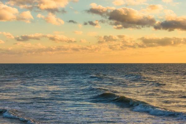 sunset sky over waves in the Gulf of Mexico