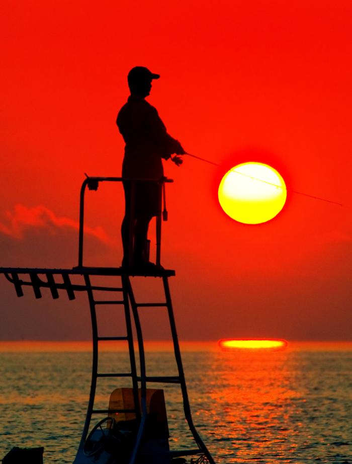 Individual fishing off vessel