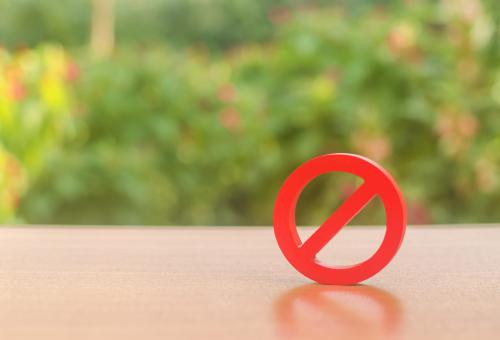 A red prohibition sign NO