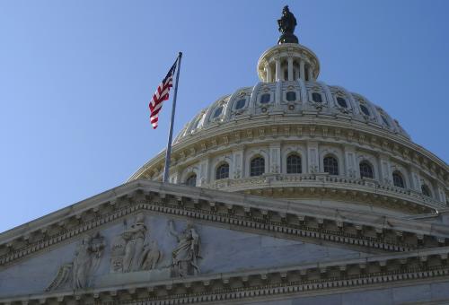 Low angle view of the historic landmkark, the Capitol building in Washington DC, flag flying