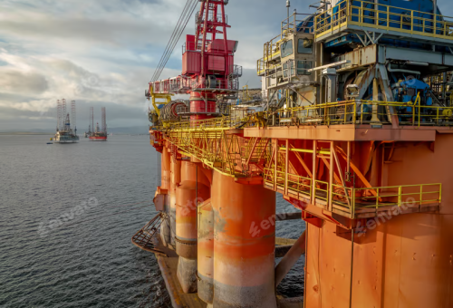 Sunset view of an oil and gas rig and platform at sea