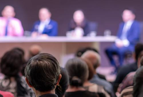 Rear view of Audience in the conference hall or seminar meeting