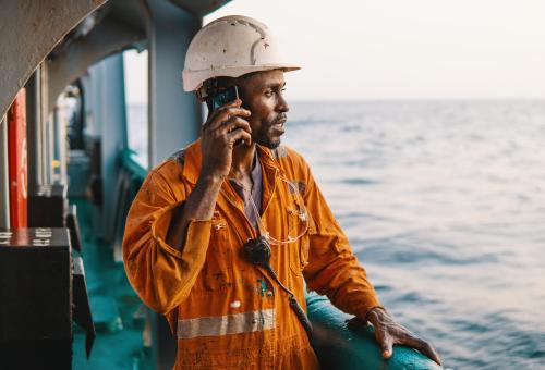 man on phone working on the water