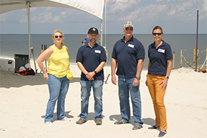 Members of BOEM in attendance at Ship Island, Miss., May 29, 2019. Pictured (L to R) Renee Orr, Chief of the Office  of Strategic Resources and Acting BOEM Deputy Director; Mike Celeta, BOEM Gulf of Mexico Regional Director; Barry Obiol, Gulf of Mexico Deputy Regional  Director: and Jessica Mallindine, Lead MMP Coordinator.  (Photo: F. Times, BOEM)