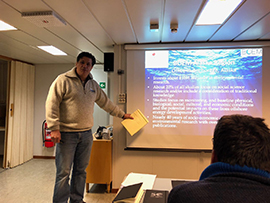 Guillermo Auad briefs expedition members on BOEM’s Alaska studies program. Photo courtesy of Francisco Werner, NOAA.