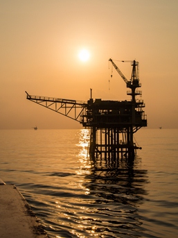Oil-Platform-Silhouette-with-Sunset