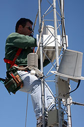 Jeff Scudder, Univ. of South Florida Ocean Monitoring and Prediction Lab, services sensors at a monitoring station.